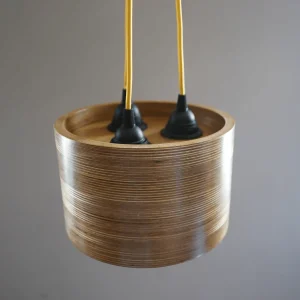 Triple Bulb Round Pendant Light made of layered birch plywood with a smooth finish, suspended by a yellow fabric cable.