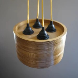 Quad Bulb Round Pendant Light made of layered birch plywood with a smooth finish, suspended by a yellow fabric cable.