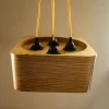 Modern 4 Bulb Square Pendant Light with exposed plywood look & hanging from green fabric cable
