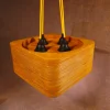 Contemporary 4 Bulb Square Pendant Light with exposed plywood look & hanging from green fabric cable