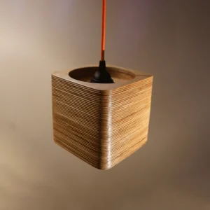 Single Bulb Square Pendant Light made of layered birch plywood with a smooth finish, suspended by an orange fabric cable