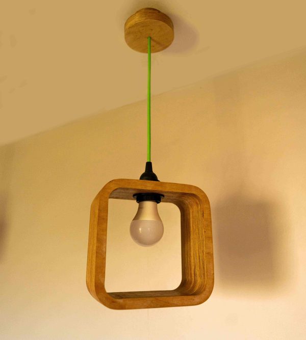 Modern Single Bulb Halo Pendant Light with exposed plywood look & hanging from green fabric cable