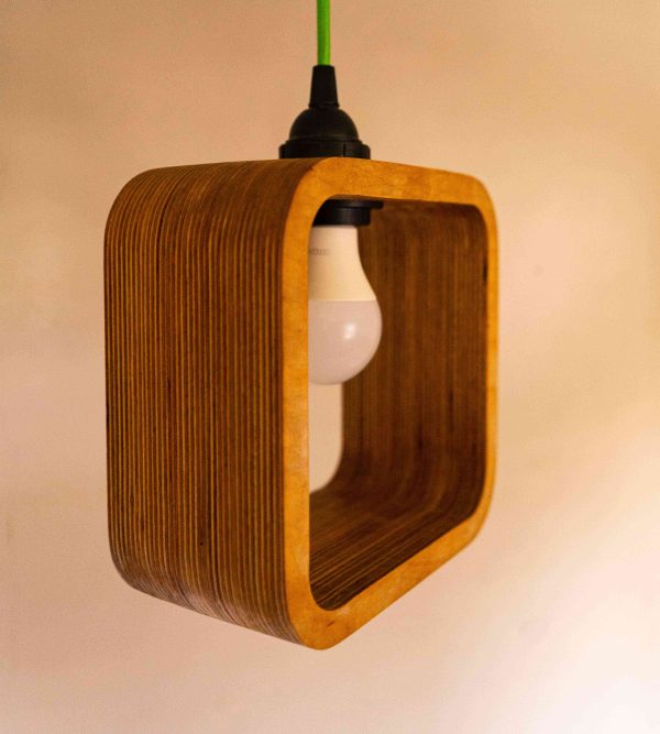 The elegance modern Single Bulb Halo Pendant Light with exposed plywood look & hanging from green fabric cable